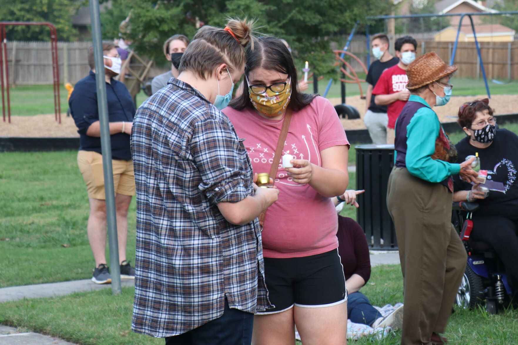 Norman Community Members Light Candles